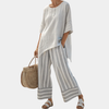 Fiorella | Blouse asymétrique élégante et pantalons rayés